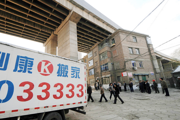 Residents move out from building under bridge