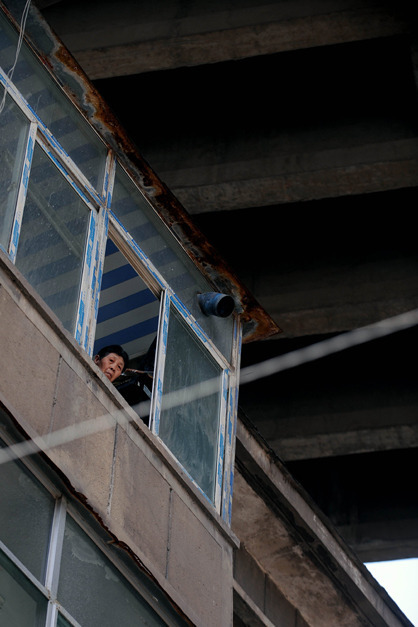 Residents move out from building under bridge