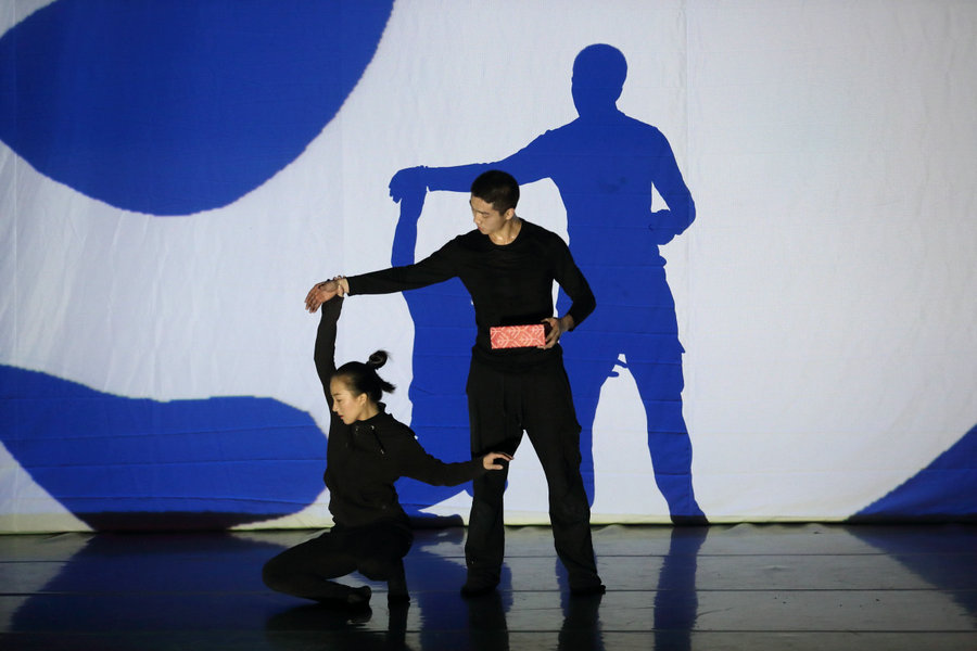 Modern dance performance represents human relationships