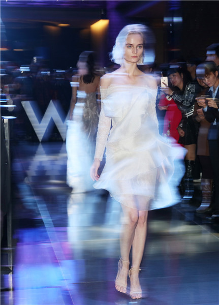 Models present creations at W Beijing's fashion wedding show