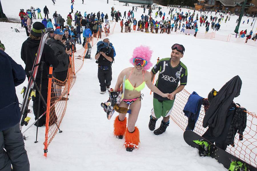 Skiing and snowboarding in bikinis and shorts