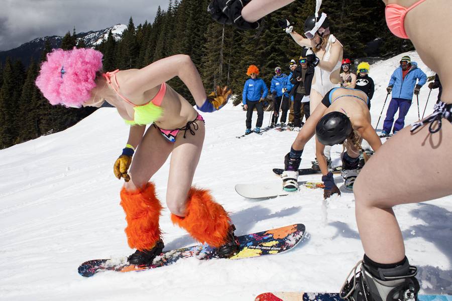 Skiing and snowboarding in bikinis and shorts