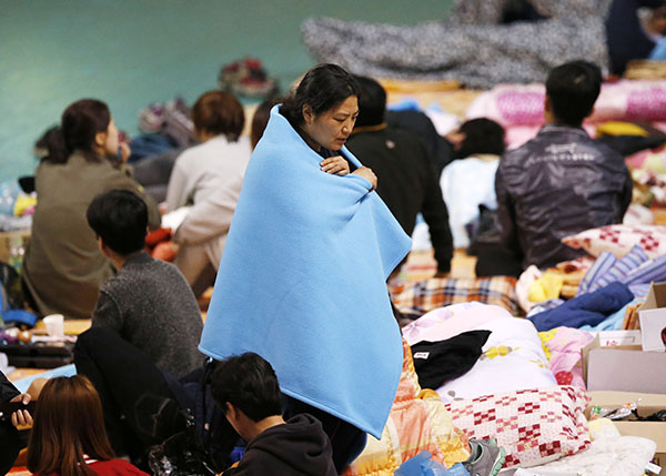 Chinese mother mourns dead son, S. Korean president calls ferry disaster 'murder'