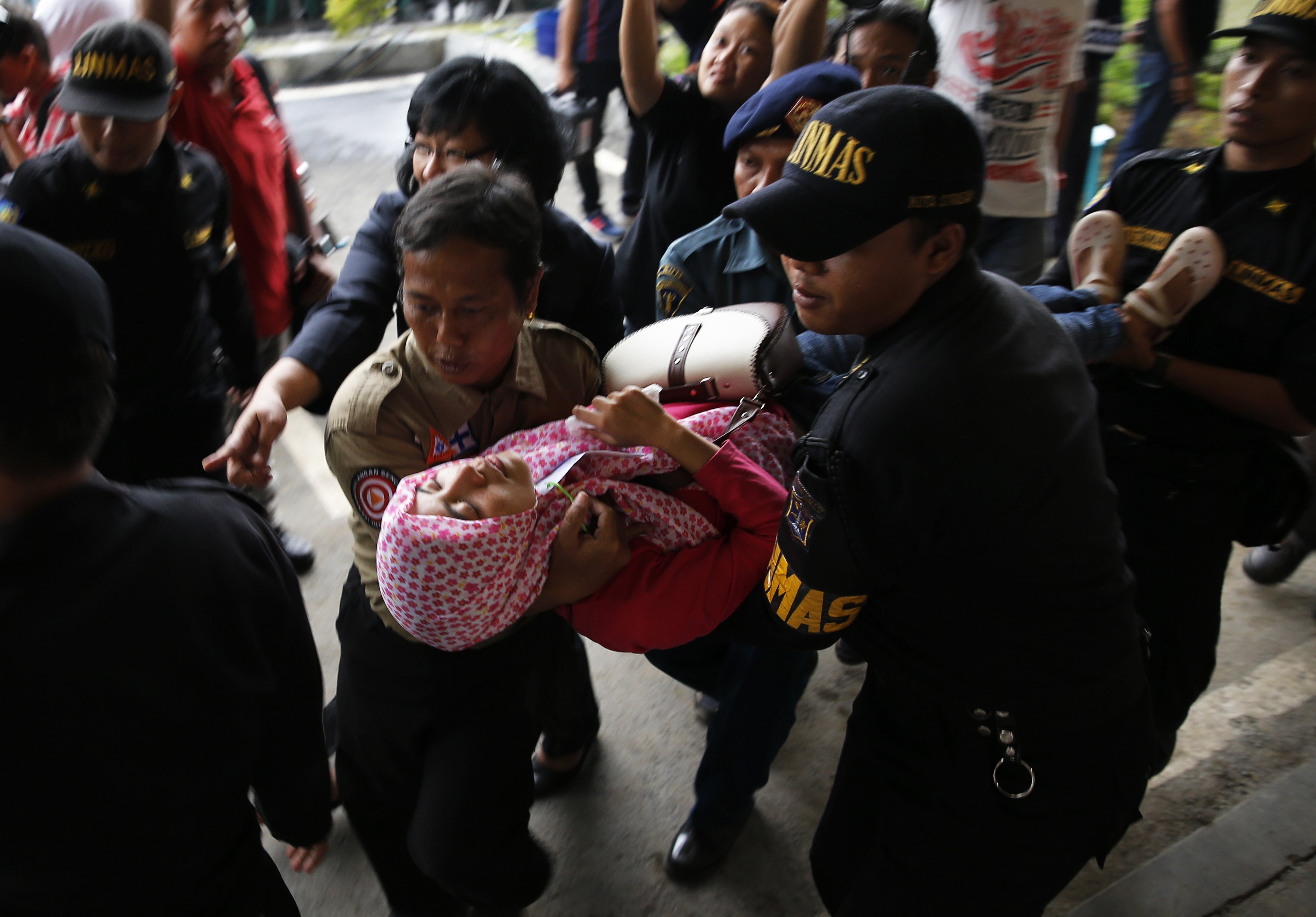 Bodies, debris from missing AirAsia plane pulled from sea off Indonesia