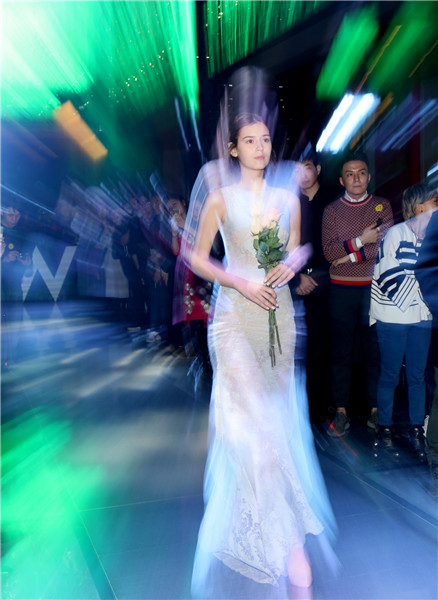 Models present creations at W Beijing's fashion wedding show