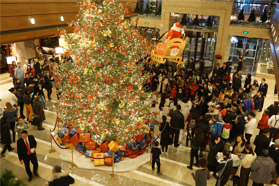 Beijing gets into Christmas spirit with illuminated trees, carols and the smell of cinnamon