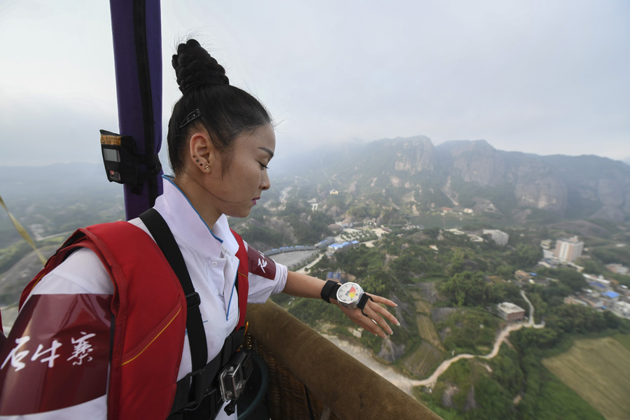 Chinese female BASE jumper leaps off hot air balloon