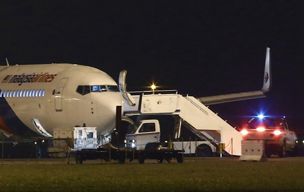 Malaysia Airlines jet turns back after tire burst