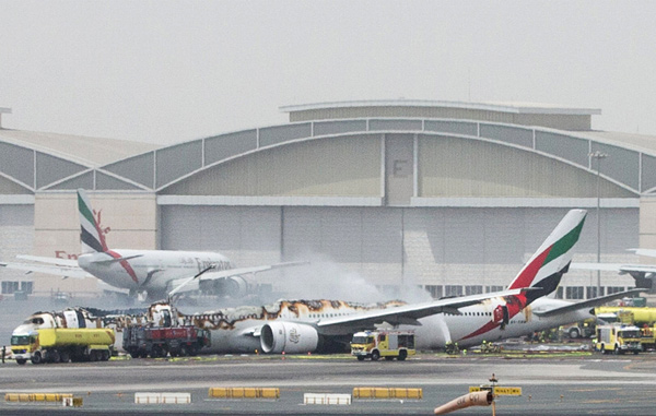 Blaze guts Emirates jet after hard landing; 1 firefighter dies